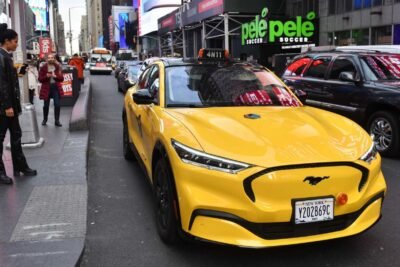 1640255614 gravity ford mustang mach e nyc yellow taxi exterior