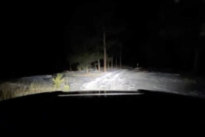 rivian r1t snowy trail at night
