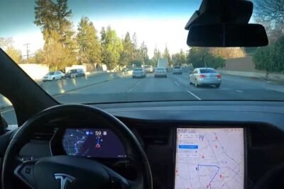tesla full self driving to service center