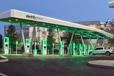 the 2022 ford f 150 lightning electric truck charging at electrify america s 200th charging station in california located at westfield valley fair shopping center in santa clara